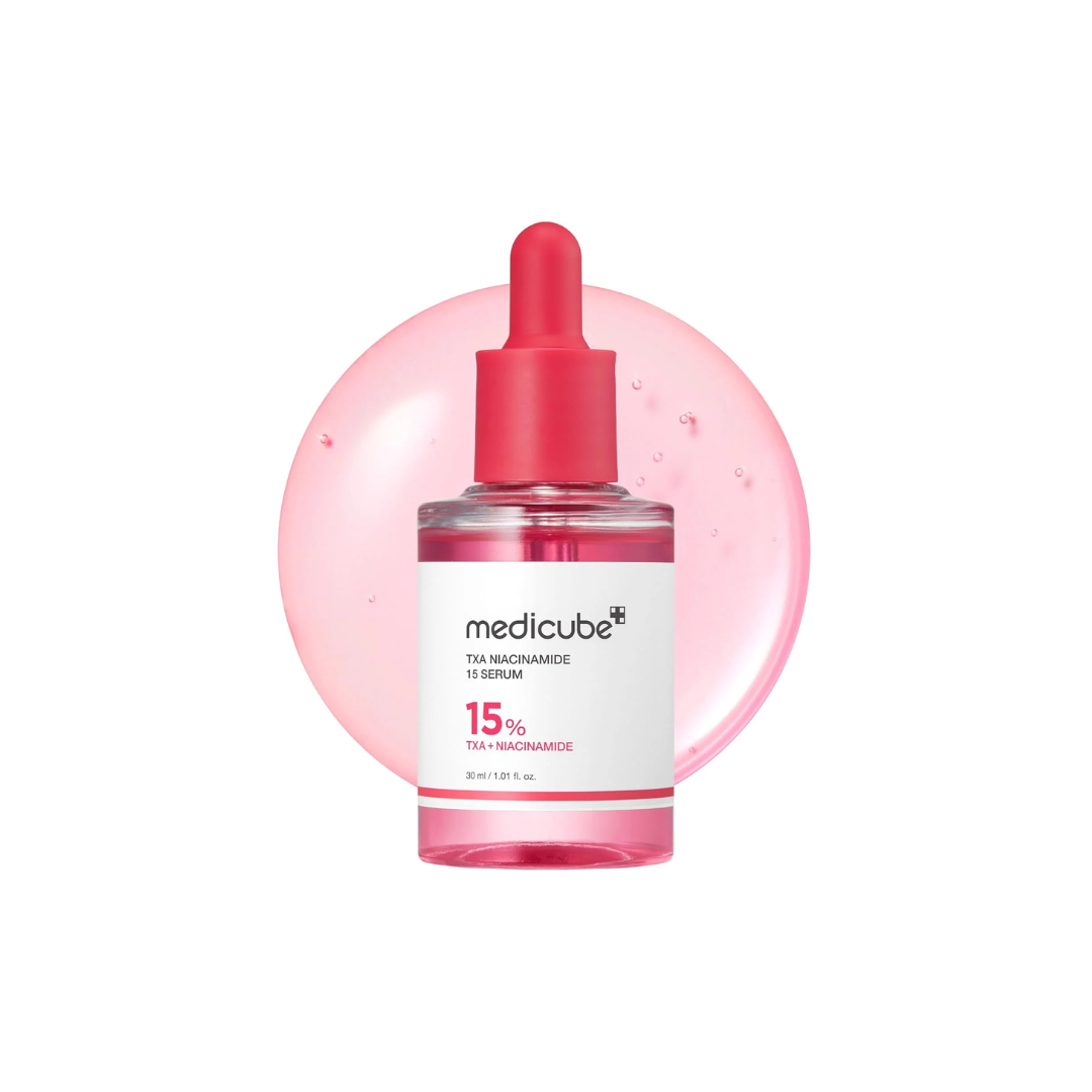 MEDICUBE TXA Niacinamide 15 Serum is a high-performance brightening serum designed to target dark spots, dullness, and uneven skin tone. With 15% Niacinamide, Tranexamic Acid, and Arbutin, it works to visibly fade hyperpigmentation and boost overall radiance. Enriched with multiple types of Hyaluronic Acid and Peptides, it also provides deep hydration and supports smoother, firmer skin. Ideal for those looking to achieve a clearer, more even, and glowing complexion.