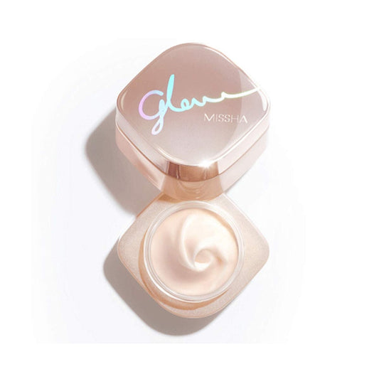 MISSHA Glow Skin Balm is a luxurious multi-purpose balm designed to hydrate, soothe, and enhance skin's natural radiance. Formulated with Rosa Damascena Flower Water and Squalane, it deeply moisturizes and smooths the skin. Niacinamide brightens and evens out skin tone, while Shea Butter and Jojoba Oil provide rich nourishment. Enriched with natural oils like Orange Peel and Mandarin Orange, it leaves the skin with a refreshing scent and a dewy, glowing finish. Perfect for those seeking a radiant and hydrat