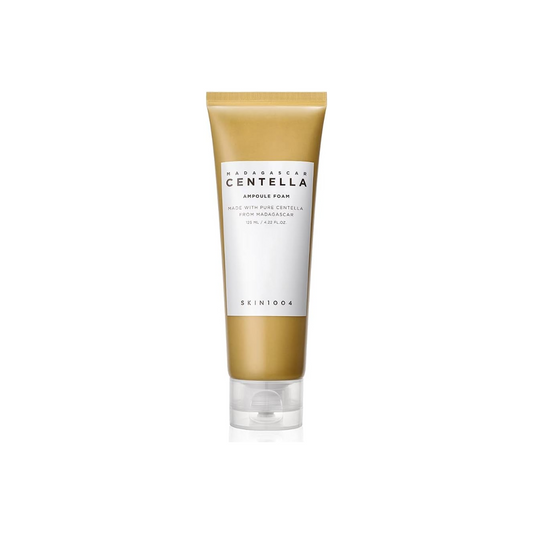 SKIN1004 Madagascar Centella Ampoule Foam is a gentle cleanser formulated with 33% Centella Asiatica Extract to soothe and calm the skin. It effectively removes impurities with mild surfactants like Sodium Cocoyl Isethionate and Coco-Betaine, while Glycerin and Sodium Hyaluronate provide hydration. This foam cleanser is perfect for those seeking a calming and refreshing cleanse without stripping moisture from the skin.