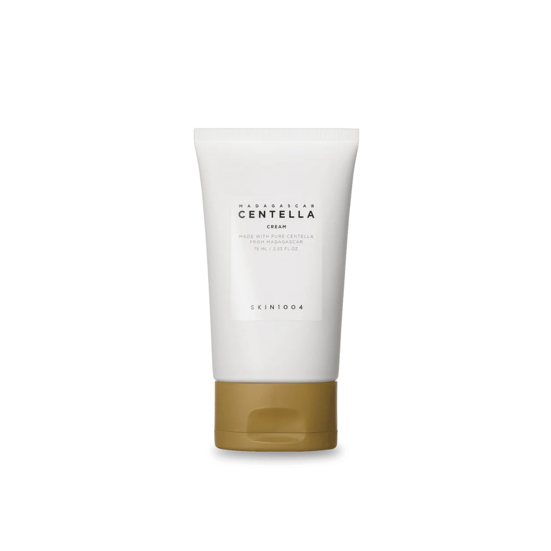 SKIN1004 Madagascar Centella Cream is a gentle, nourishing moisturizer that calms irritation, strengthens the skin barrier, and deeply hydrates. Formulated with Centella Asiatica Extract, Niacinamide, and soothing botanicals like Chamomile and Licorice Root, it helps reduce redness and support healthy skin. Rich in plant oils like Macadamia, Shea Butter, and Squalane, it provides long-lasting moisture without feeling heavy. This cream is ideal for sensitive, dry, or combination skin and works well for those
