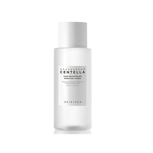 SKIN1004 Madagascar Centella Tone Brightening Boosting Toner is a hydrating and brightening toner formulated with Centella Asiatica Extract to soothe and calm the skin. Enriched with Niacinamide and 2-O-Ethyl Ascorbic Acid, it helps brighten the complexion and improve skin tone. The addition of fruit extracts like Apple, Papaya, and Grape provides gentle exfoliation and nourishment, leaving the skin smooth and revitalized. This toner prepares the skin for better absorption of the following skincare steps wh